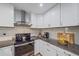 Modern kitchen features granite countertops and sleek, stainless steel appliances at 4396 Pasadena Cir, Sarasota, FL 34233