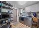 The laundry room features a washer and dryer, shelves, and access to outside at 4396 Pasadena Cir, Sarasota, FL 34233