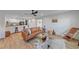 Bright and open living area with modern furniture and view to the kitchen at 4396 Pasadena Cir, Sarasota, FL 34233