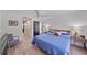 Bedroom features a large bed, ensuite bathroom and a ceiling fan at 4396 Pasadena Cir, Sarasota, FL 34233