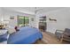 Bedroom showcasing light and bright room, ceiling fan, and sliding glass doors at 4396 Pasadena Cir, Sarasota, FL 34233