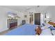 Bedroom featuring a large bed, lots of light, ceiling fan and ensuite bathroom at 4396 Pasadena Cir, Sarasota, FL 34233