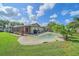 Backyard with a private pool and lush tropical landscaping at 4396 Pasadena Cir, Sarasota, FL 34233