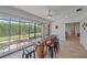 Sunroom offers lots of bright light and an interesting table made from a tree trunk at 4396 Pasadena Cir, Sarasota, FL 34233