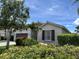 Lovely single story home with lush landscaping in the front yard and a beautiful front window at 4407 67Th E St, Bradenton, FL 34203