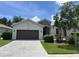 Charming single Gathering home with a stone accents and a two-car garage and a brick driveway at 4407 67Th E St, Bradenton, FL 34203