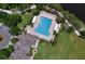 An aerial view of the community pool with plenty of lounge chairs around it and beautiful landscaping at 4716 98Th E Ter, Parrish, FL 34219