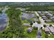 Aerial view of property showcasing its location near a pond and surrounded by lush greenery at 4716 98Th E Ter, Parrish, FL 34219
