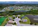 An aerial view of the community featuring lush landscaping, serene lakes, and single-Gathering homes at 4716 98Th E Ter, Parrish, FL 34219