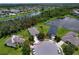 Bird's eye view highlights home surrounded by lush landscaping and nearby neighborhood amenities at 4716 98Th E Ter, Parrish, FL 34219
