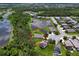 Aerial view of property showcasing its location near a pond and surrounded by lush greenery at 4716 98Th E Ter, Parrish, FL 34219