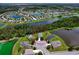 An aerial view of the neighborhood, featuring single-Gathering homes, serene lakes, and community features at 4716 98Th E Ter, Parrish, FL 34219