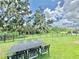 Spacious backyard perfect for outdoor entertaining with lush green grass and decorative wrought iron patio furniture at 4716 98Th E Ter, Parrish, FL 34219