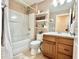 Cozy full bathroom with bathtub, shower, vanity, and tile flooring at 4716 98Th E Ter, Parrish, FL 34219