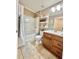 Cozy full bathroom with bathtub, shower, vanity, and tile flooring at 4716 98Th E Ter, Parrish, FL 34219