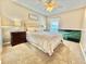 Neutral bedroom with plush carpet, decorative ceiling fan, and a large comfortable bed at 4716 98Th E Ter, Parrish, FL 34219