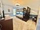 bedroom featuring a wooden bunk bed, dresser, and soft blue walls at 4716 98Th E Ter, Parrish, FL 34219