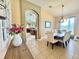 Formal dining room with a large table and chairs, chandelier, and view into the living space at 4716 98Th E Ter, Parrish, FL 34219