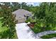 Well-maintained single-story home with neutral siding, mature landscaping, and an attached two-car garage at 4716 98Th E Ter, Parrish, FL 34219