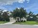 Charming single-Gathering home with a well-kept lawn, mature trees, and an inviting front entrance at 4716 98Th E Ter, Parrish, FL 34219