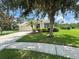 Charming single-story home with a well-kept lawn, landscaping, a two-car garage, and a welcoming entryway at 4716 98Th E Ter, Parrish, FL 34219