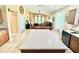 Open kitchen with center island, breakfast bar, and view of the dining and living areas at 4716 98Th E Ter, Parrish, FL 34219