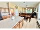 Open-concept layout with large kitchen island, dining area, and inviting living room with lots of natural light at 4716 98Th E Ter, Parrish, FL 34219