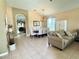 Open living space with dining area, comfortable seating, and neutral color palette throughout at 4716 98Th E Ter, Parrish, FL 34219
