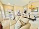 Inviting living space with sofa, dining area, and decorative touches offering a cozy and open feel at 4716 98Th E Ter, Parrish, FL 34219