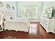 Beautiful main bedroom with hardwood floors, natural light, and neutral-color walls at 4716 98Th E Ter, Parrish, FL 34219