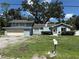 Charming blue two-story home with well-maintained landscaping and attached two-car garage at 5124 17Th Street E Ct, Bradenton, FL 34203