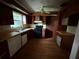 Kitchen with wood cabinets and black appliances, offering a practical layout for cooking and storage at 5124 17Th Street E Ct, Bradenton, FL 34203