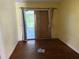 Living room with sliding glass doors to the backyard and hardwood floors at 5124 17Th Street E Ct, Bradenton, FL 34203