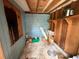 Storage area with wood shelving and paint-covered walls, offering room for tools and household items at 5124 17Th Street E Ct, Bradenton, FL 34203