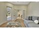 Hallway with natural light, shiplap accent wall, and access to the outdoor patio at 5139 50Th W Ave, Bradenton, FL 34210