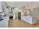 Modern kitchen features white cabinets, stainless steel appliances, and a large island with seating at 5139 50Th W Ave, Bradenton, FL 34210
