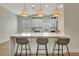 Open concept kitchen with center island, bar stool seating, and modern lighting at 5139 50Th W Ave, Bradenton, FL 34210
