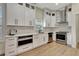 Bright kitchen featuring stainless steel appliances, white cabinetry, and modern fixtures at 5139 50Th W Ave, Bradenton, FL 34210