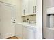 Convenient laundry room with washer, dryer, and cabinetry for storage at 5139 50Th W Ave, Bradenton, FL 34210