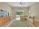 Spacious living room featuring a large sectional, and a sliding door to the pool at 5139 50Th W Ave, Bradenton, FL 34210