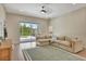 Bright living room with a view to the pool, a cozy sofa, and tile flooring at 5139 50Th W Ave, Bradenton, FL 34210