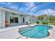 A screened in pool with lounge chairs on the deck at 5139 50Th W Ave, Bradenton, FL 34210
