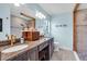 Stylish bathroom with double sink vanity, granite countertop, and modern fixtures at 529 Sunset N Rd, Rotonda West, FL 33947