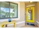 Welcoming entryway featuring a bright yellow door and decorative accents at 529 Sunset N Rd, Rotonda West, FL 33947