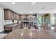 Modern kitchen with granite countertops, stainless steel appliances, and ample storage at 529 Sunset N Rd, Rotonda West, FL 33947