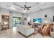 Spacious living room with tray ceilings, tile floors, and comfortable furnishings at 529 Sunset N Rd, Rotonda West, FL 33947
