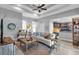 Open concept living room with comfortable seating and adjacent kitchen area at 529 Sunset N Rd, Rotonda West, FL 33947