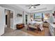 Comfortable main bedroom with tray ceiling, ceiling fan, and natural light from windows at 529 Sunset N Rd, Rotonda West, FL 33947