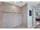 Walk-in shower featuring tiled walls and floor, and modern fixtures at 529 Sunset N Rd, Rotonda West, FL 33947