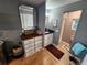 Bathroom featuring a small black vanity, framed mirror, and separate area with toilet and shower at 5316 Chateau Ln, Bradenton, FL 34207